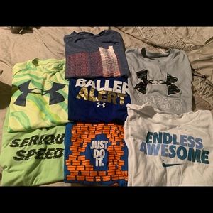 7 youth large athletic t shirts. Under armour and Nike.